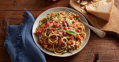 recipe image Vine-Ripened Tomato Turkey Bolognese with Zucchini Noodles